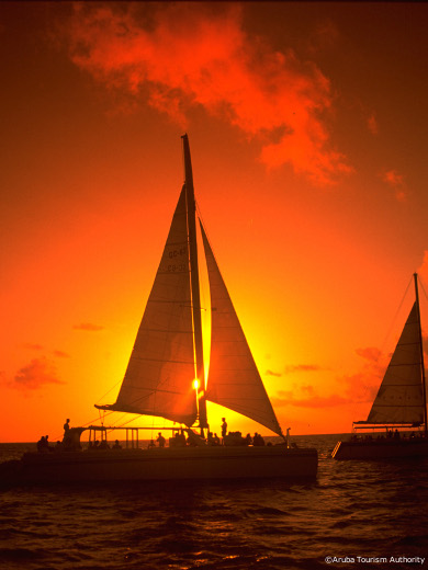 sailing at sunset in aruba, dutch antilles, caribbean